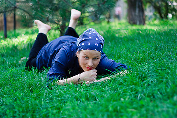 Image showing Beautiful young woman lying in the grass