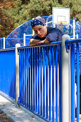 Image showing Beautiful young woman on a basketball field