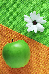 Image showing White chrysanthemum and green apple
