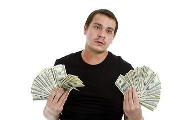 Image showing sad man with lots of money