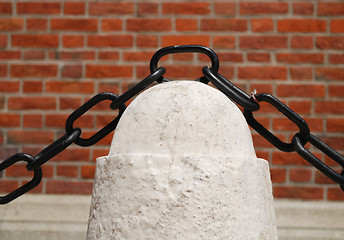 Image showing ancient rusty chain and stone column