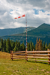 Image showing Wind sleeve and mountains