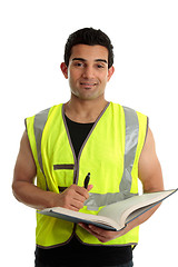 Image showing Construction worker with pen and book
