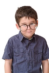 Image showing Little boy in funny round spectacles stands isolated