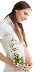 Image showing Happy caring woman expecting baby