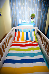 Image showing nursery room and baby cot