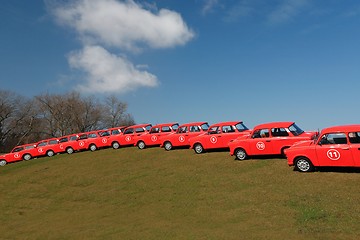 Image showing red cars  in row