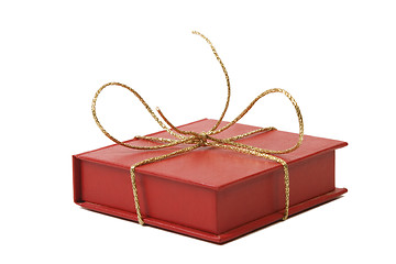 Image showing red present box with golden shiny ribbon