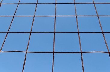 Image showing Converging view of rusty lattice on sky background 