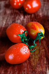 Image showing tomatoes on wooden table