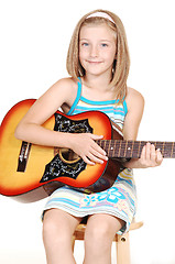 Image showing Young blond girl with guitar.