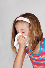 Image showing Young girl sneezing.