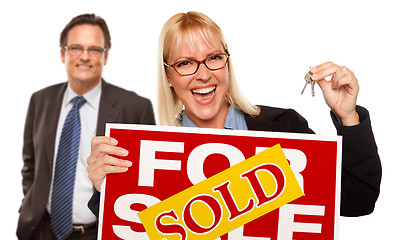 Image showing Man with Blonde Woman Holding Keys and Sold For Sale Sign