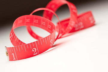 Image showing Red Measuring Tape on Gradated Background