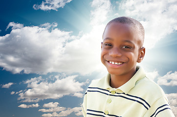 Image showing Young African American Boy with Clouds and Sky