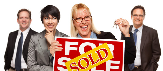 Image showing Real Estate Team with Woman Holding Keys and Sold For Sale Sign