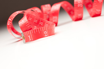 Image showing Red Measuring Tape on Gradated Background