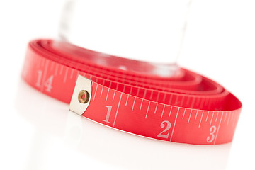 Image showing Red Measuring Tape and Water Bottle on White