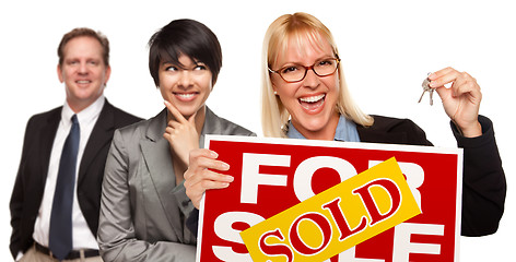 Image showing Real Estate Team with Woman Holding Keys and Sold For Sale Sign