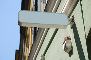 Image showing sign henging on a wall 