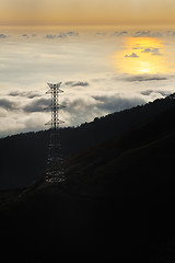 Image showing Electricity pylon over valley at sunset, Lomba das Torres,  Madeira island, Portugal
