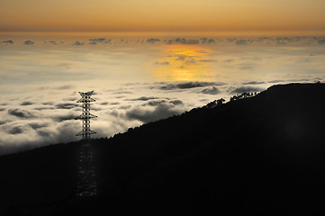 Image showing Electricity pylon over valley at sunset, Lomba das Torres,  Madeira island, Portugal