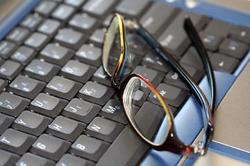 Image showing Glasses on laptop