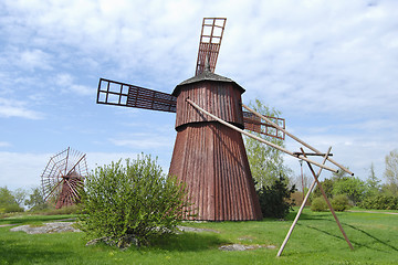 Image showing Two Red Wooden Mills