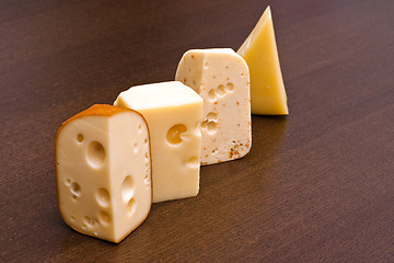 Image showing Row of cheeses