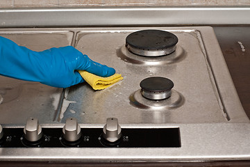 Image showing Polishing a gas stove