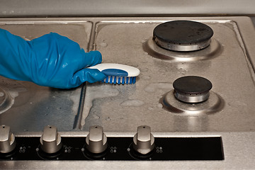 Image showing Cleaning a gas stove