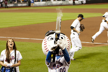 Image showing Mr. Mets shooting T-Shirt gun