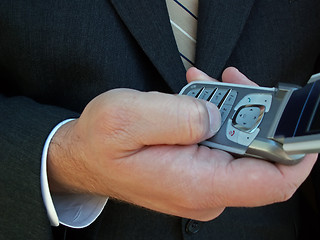 Image showing using a cell phone