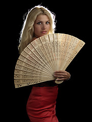 Image showing Hot blonde in red dress with fan