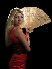 Image showing Hot blonde in red dress with fan