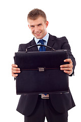 Image showing man handing a brief case