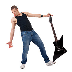 Image showing holding guitar on foot