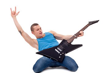 Image showing playing guitar on knees