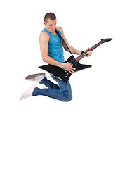 Image showing passionate guitarist jumps