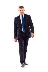 Image showing young businessman is walking