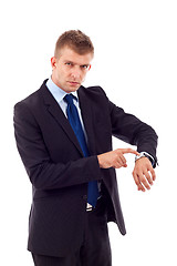 Image showing  looking and pointing at his watch