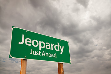 Image showing Jeopardy Green Road Sign Over Storm Clouds