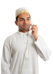 Image showing Arab man wearing white robe and topi