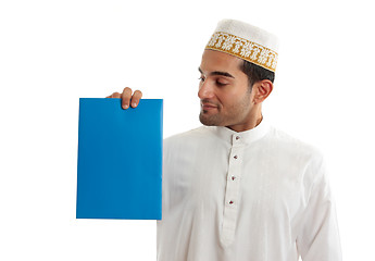 Image showing Ethnic businessman holding brochure