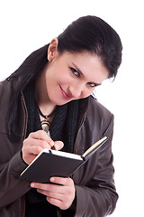 Image showing beautiful businesswoman taking notes