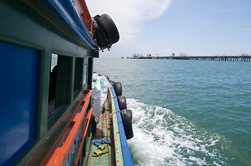 Image showing Old, wooden supply boat in Thailand.