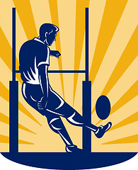 Image showing rugby player kicking at goal post