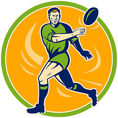 Image showing Rugby player running and passing ball