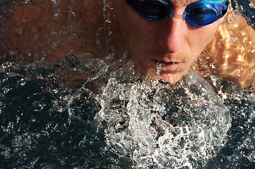 Image showing Detail of young man swimming