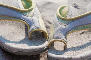 Image showing  Flip-flops and sand